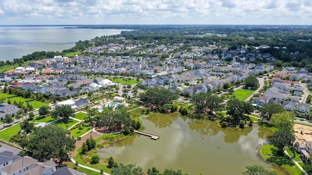 bird's eye view with a residential view and a water view