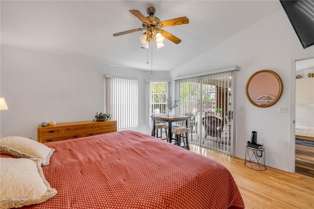 bedroom featuring access to exterior, lofted ceiling, light wood-style flooring, ceiling fan, and baseboards