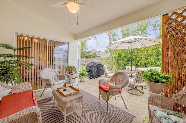 view of patio with ceiling fan, grilling area, and an outdoor living space