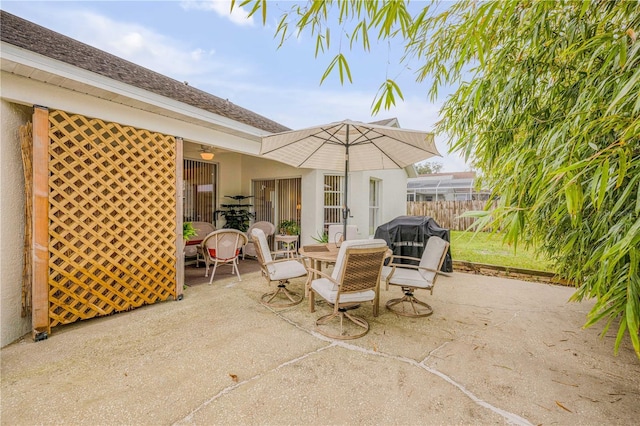 view of patio / terrace featuring outdoor dining area, fence, and area for grilling