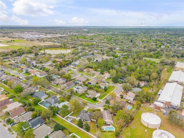 bird's eye view featuring a water view and a residential view