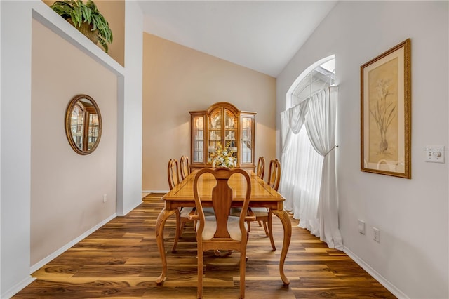 1145 Lake Rogers Cir, Oviedo, FL 32765 - dining space featuring high vaulted ceiling and dark wood-type flooring