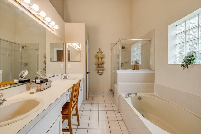 1145 Lake Rogers Cir, Oviedo, FL 32765 - bathroom featuring double vanity, a shower stall, a garden tub, and tile patterned floors