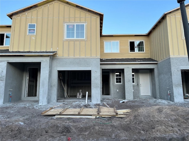 view of front facade featuring a garage and board and batten siding