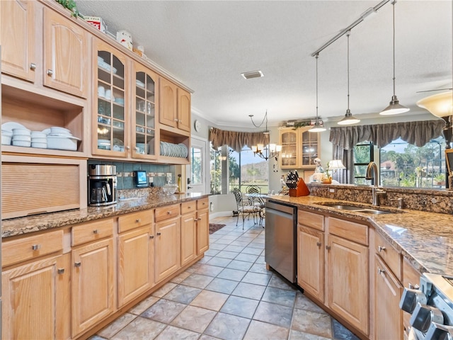 kitchen featuring dishwasher, a sink, and light brown cabinets