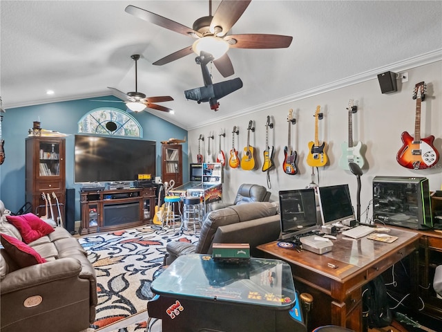 living room with lofted ceiling, ceiling fan, and ornamental molding