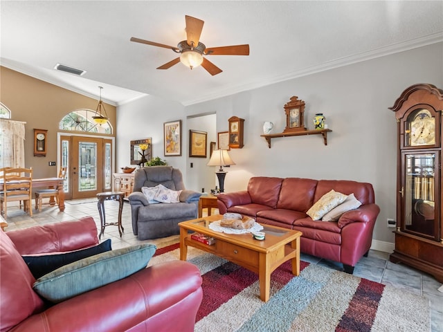 tiled living area with visible vents, crown molding, baseboards, and ceiling fan