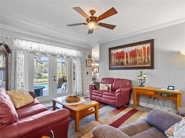 living area with baseboards, a ceiling fan, french doors, a textured ceiling, and crown molding