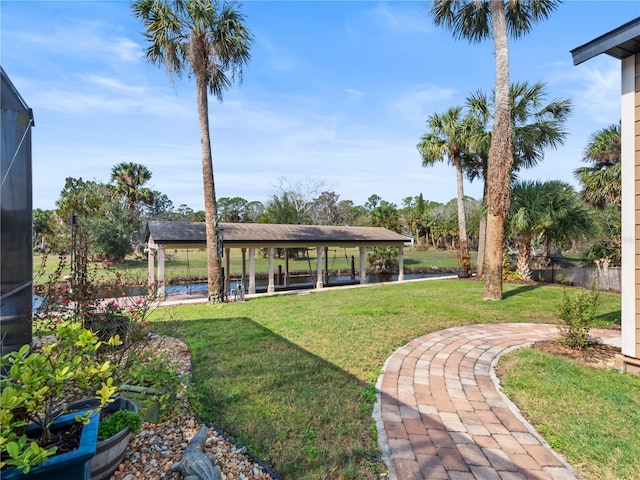 view of yard with glass enclosure and a gazebo