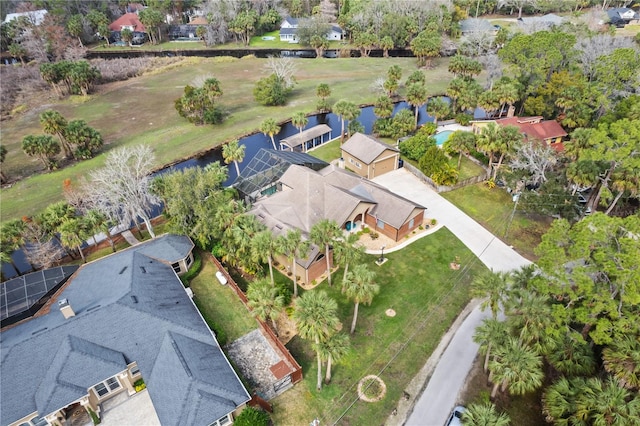 bird's eye view featuring a water view and a residential view