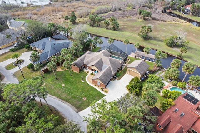 drone / aerial view featuring a residential view and a water view