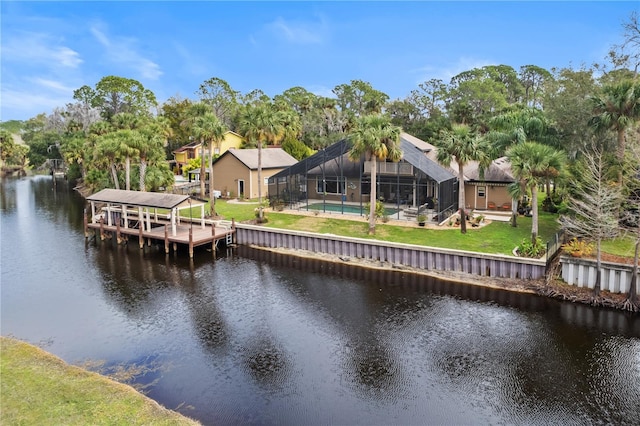 view of dock featuring an outdoor pool, glass enclosure, a water view, and a lawn