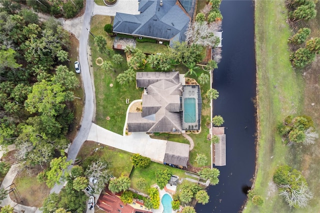 birds eye view of property with a water view