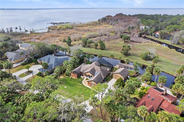 birds eye view of property with a residential view and a water view