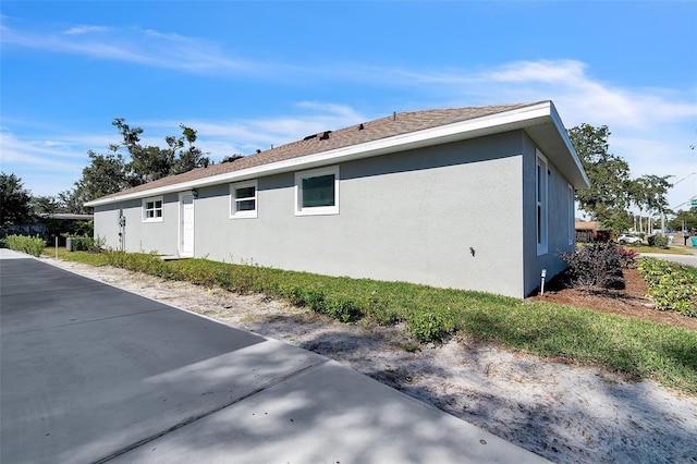 view of property exterior with stucco siding