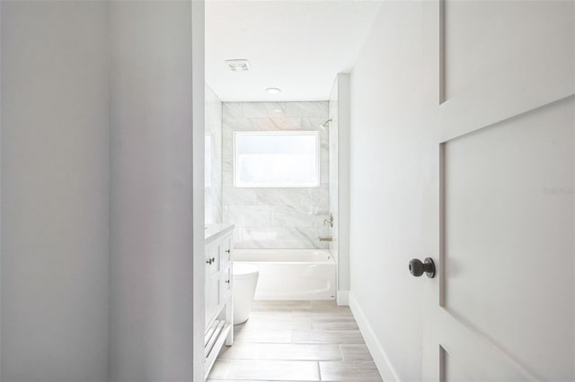 full bathroom featuring shower / bath combination, baseboards, visible vents, and vanity