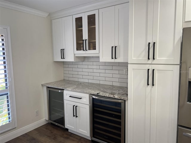 bar featuring dark wood-type flooring, wine cooler, backsplash, and crown molding