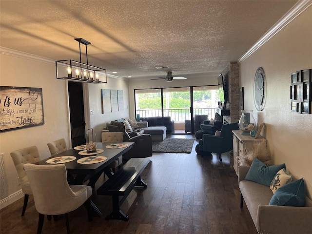 dining area featuring a textured ceiling, dark wood-type flooring, crown molding, and ceiling fan with notable chandelier