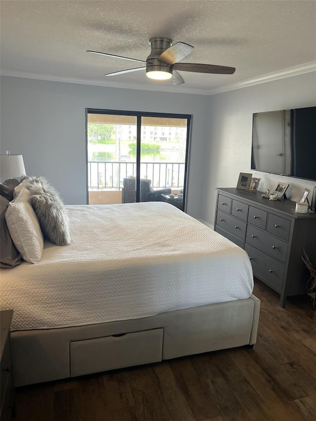 bedroom featuring dark wood-style floors, ceiling fan, a textured ceiling, and crown molding