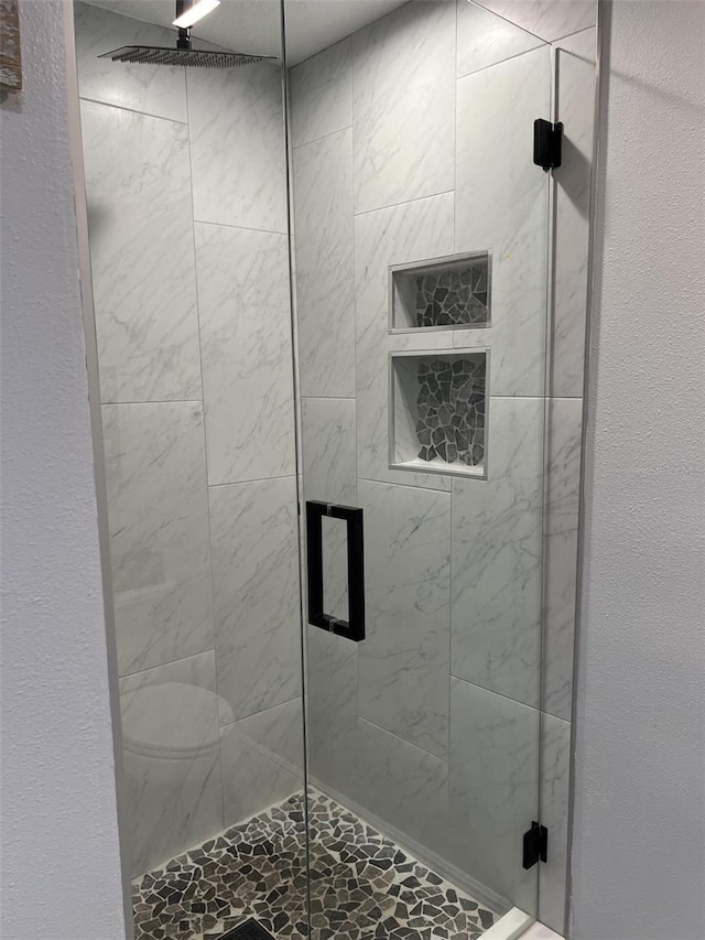 bathroom with a stall shower