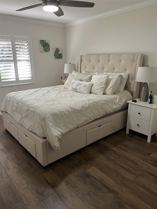 bedroom with ceiling fan, ornamental molding, and dark wood finished floors