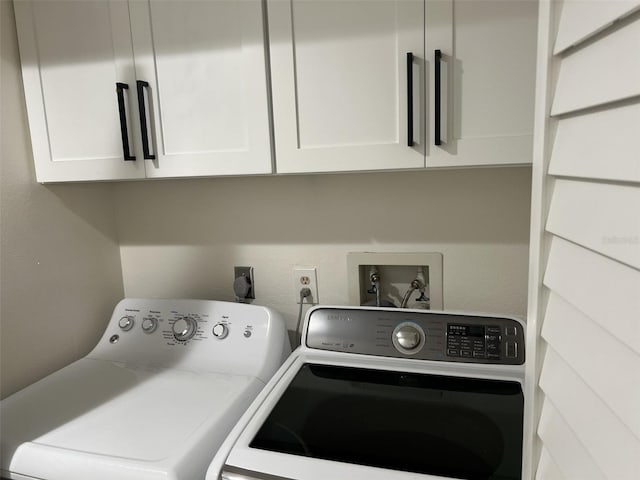 laundry room featuring cabinet space and washer and dryer