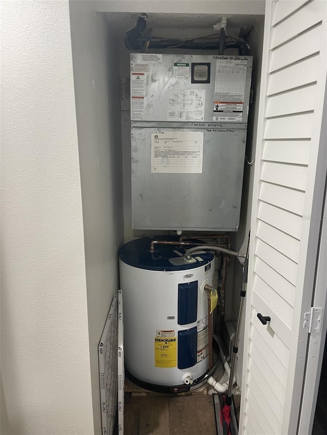 utility room featuring water heater