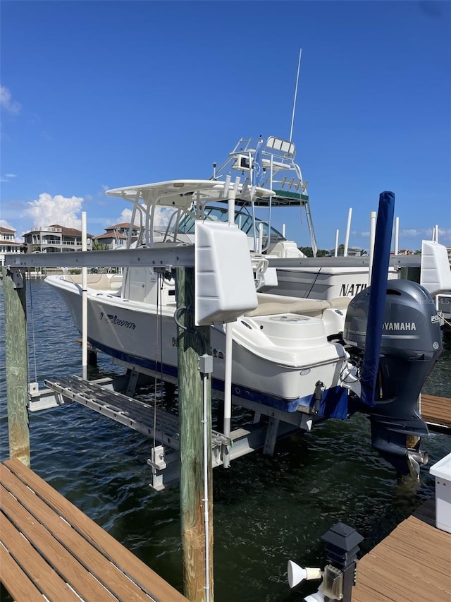 view of dock with a water view and boat lift