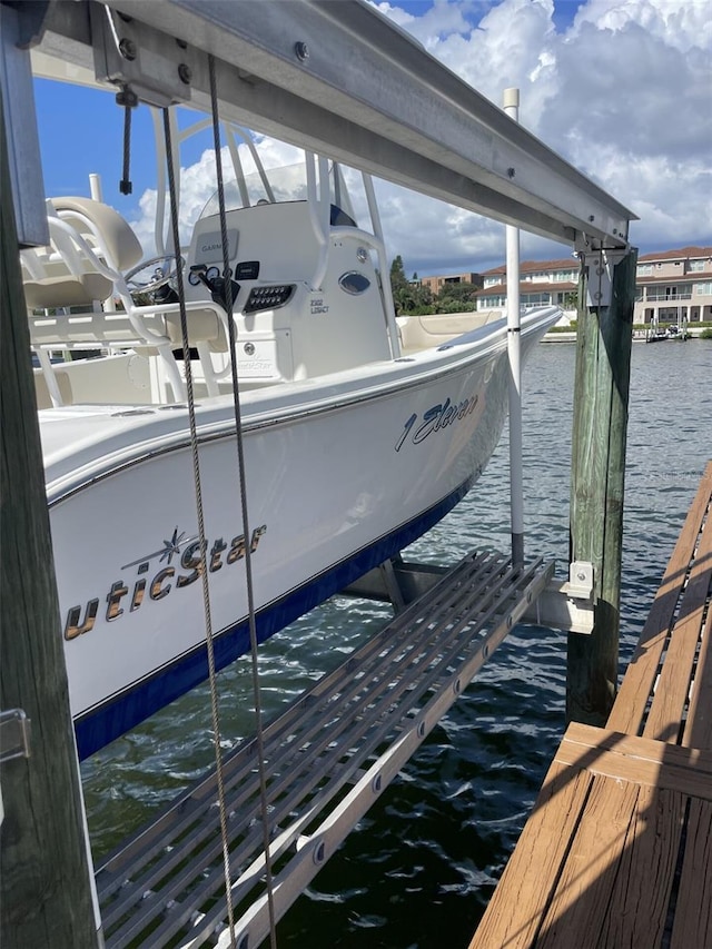 dock area featuring a water view and boat lift