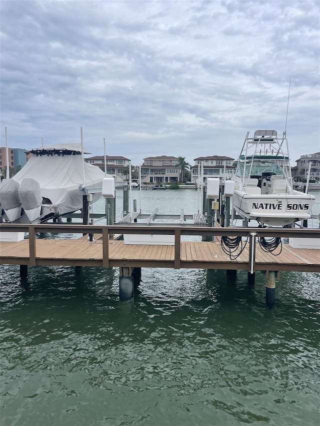 view of dock with a water view and boat lift