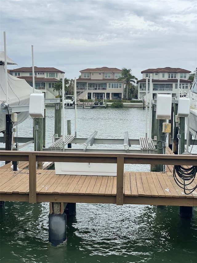 view of dock with a water view and boat lift