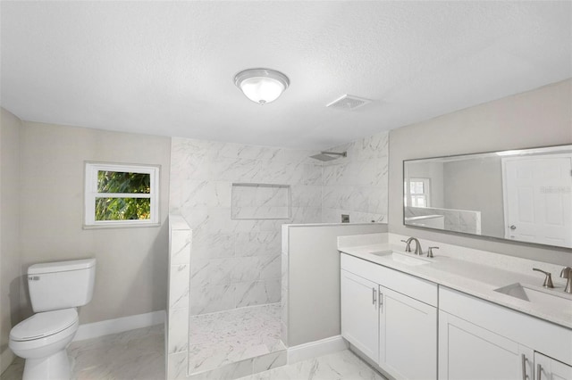 1203 S Pomegranite Ave, Sanford, FL 32771 - full bathroom featuring visible vents, marble finish floor, a sink, and a walk in shower