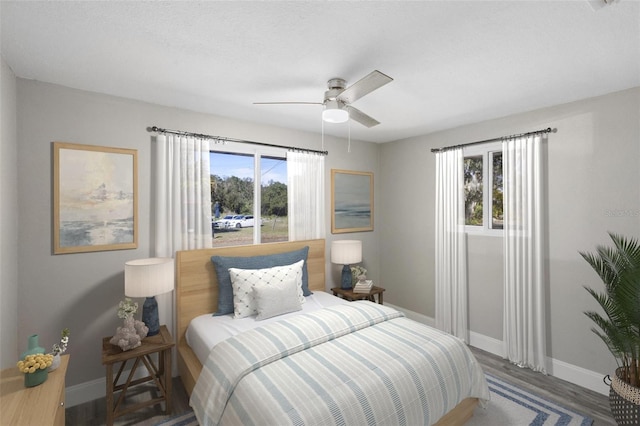 1203 S Pomegranite Ave, Sanford, FL 32771 - bedroom with ceiling fan, baseboards, and wood finished floors