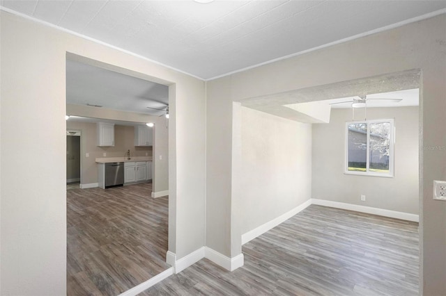 1203 S Pomegranite Ave, Sanford, FL 32771 - unfurnished room featuring ceiling fan, baseboards, and wood finished floors