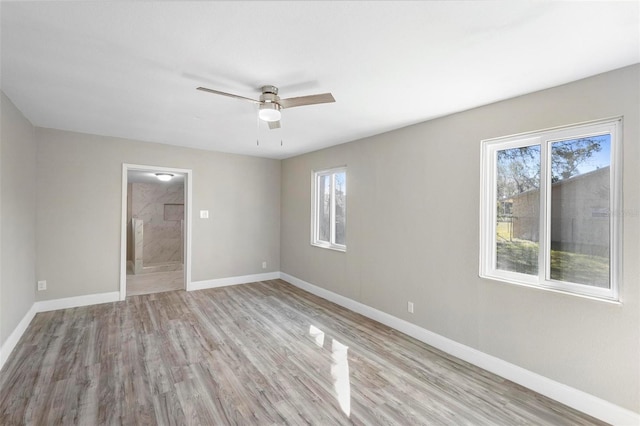 1203 S Pomegranite Ave, Sanford, FL 32771 - unfurnished room with ceiling fan, baseboards, and light wood-type flooring