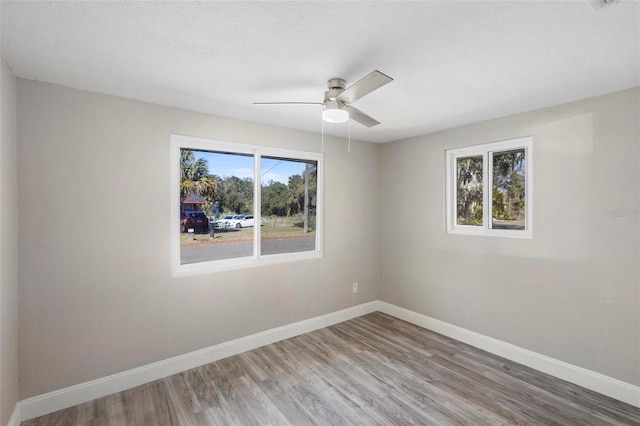 1203 S Pomegranite Ave, Sanford, FL 32771 - empty room featuring wood finished floors, baseboards, and a ceiling fan