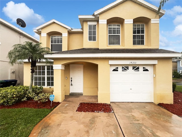 traditional-style home with a garage, a shingled roof, and stucco siding