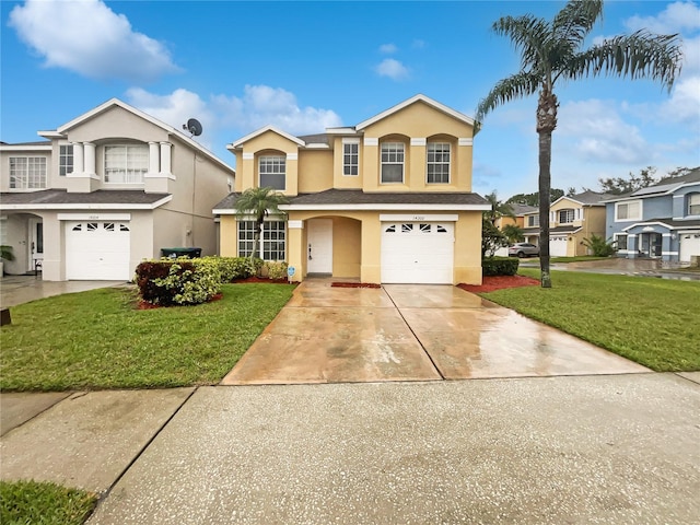 traditional-style house featuring a garage, a front lawn, concrete driveway, and stucco siding