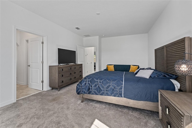 bedroom with light carpet, baseboards, and visible vents