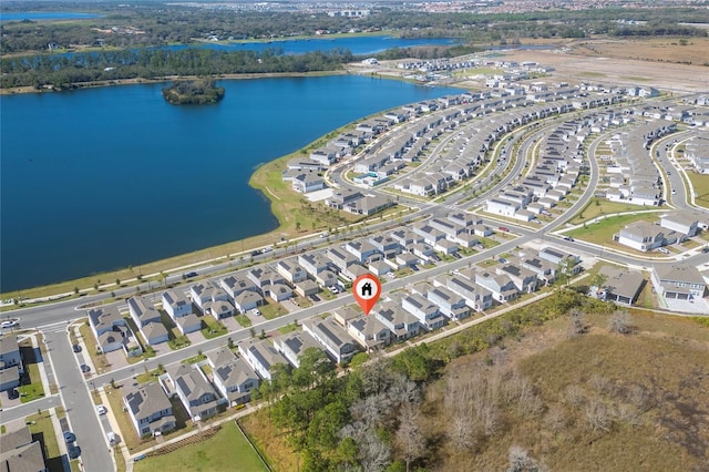 birds eye view of property with a water view and a residential view