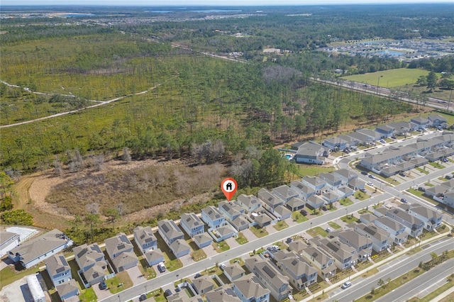 birds eye view of property with a residential view