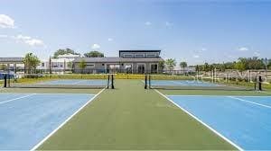 view of tennis court featuring community basketball court