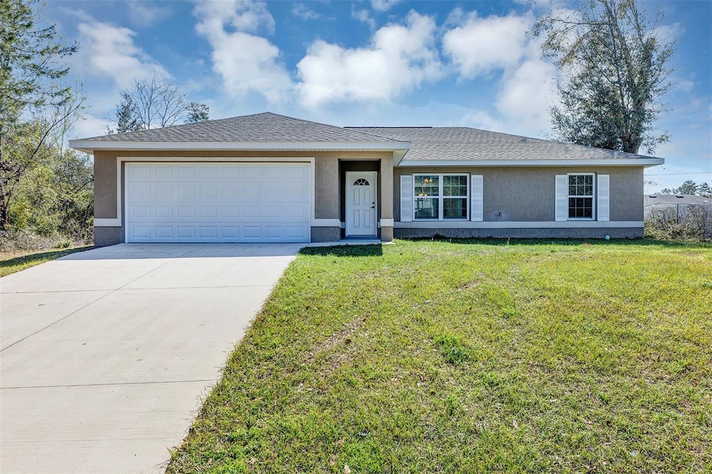 ranch-style house with a garage, a shingled roof, driveway, stucco siding, and a front yard