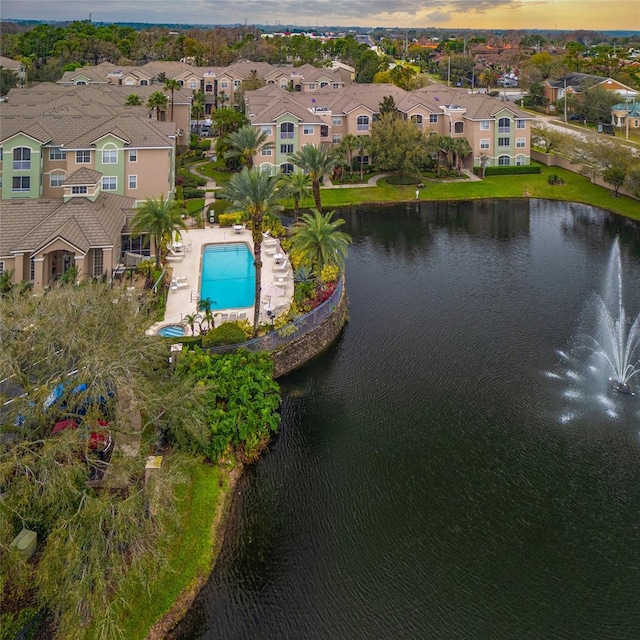 birds eye view of property featuring a water view and a residential view