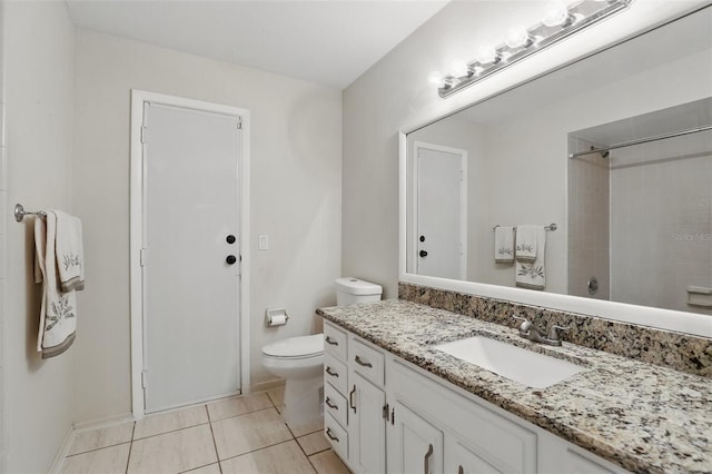 bathroom with toilet, tile patterned floors, walk in shower, and vanity