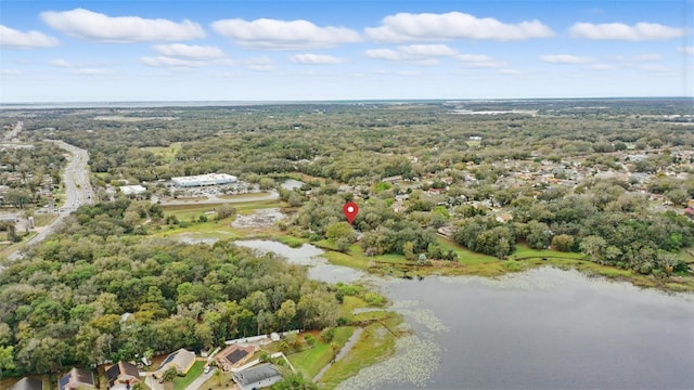 bird's eye view with a water view and a view of trees