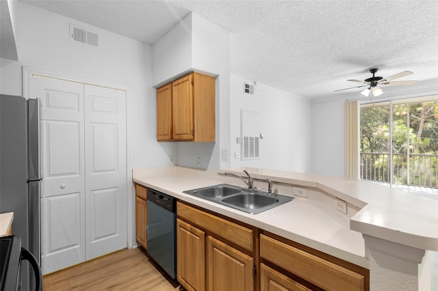13037 Mulberry Park Dr Unit 529, Orlando, FL 32821 - kitchen featuring dishwasher, freestanding refrigerator, ceiling fan, a textured ceiling, and light countertops