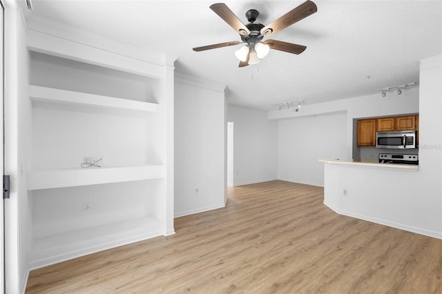 13037 Mulberry Park Dr Unit 529, Orlando, FL 32821 - unfurnished living room with light wood-style floors, rail lighting, and a ceiling fan