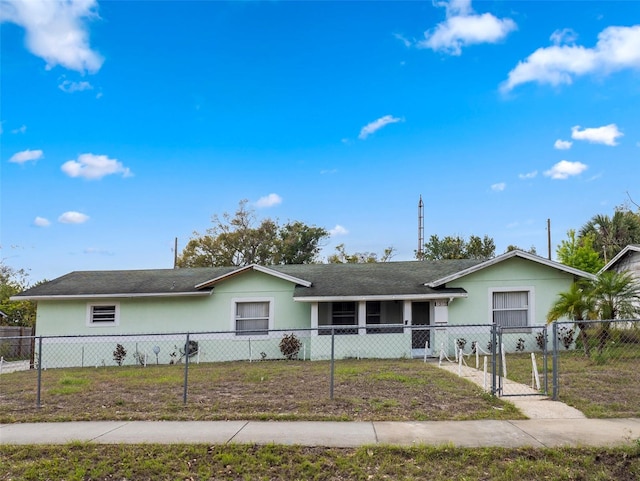 ranch-style house with a fenced front yard, a gate, and stucco siding