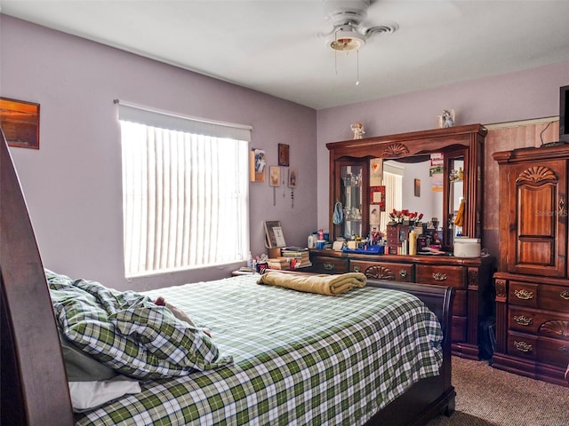 carpeted bedroom with a ceiling fan